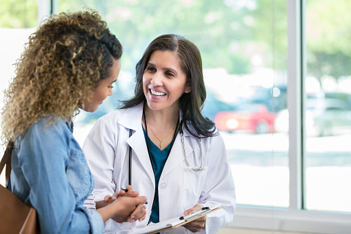 Associate visits health center