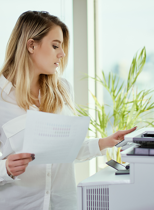 Person using a printer or copier.