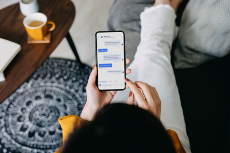 A customer beginning the car buying process from home on their cell phone.