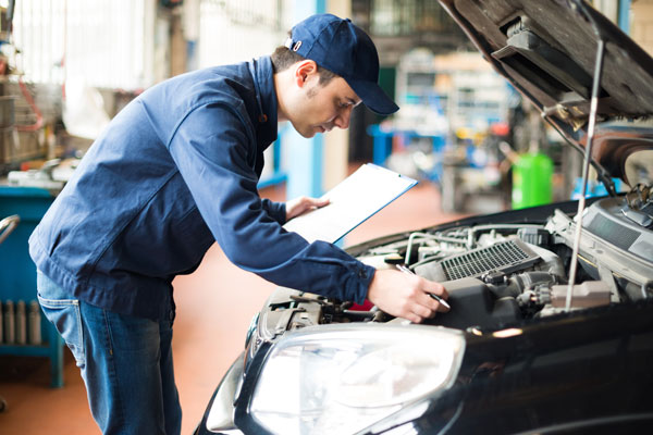 technician repairing a car