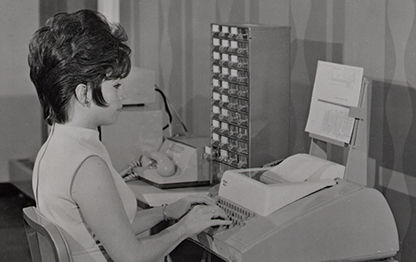 Woman from 1960 typing 